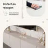A marketing image showing a hand cleaning a surface and a close-up of a TV lowboard with decorative items. Produktbild-Vorschau