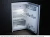 An open refrigerator with its interior illuminated. Produktbild-Vorschau
