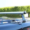Close-up of a silver roof rack on a black car, with a green hedge in the background. Náhľad obrázku produktu
