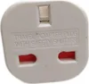 A close-up of a white travel adapter plug with red socket openings. Podgląd zdjęcia produktu