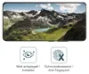A smartphone screen displaying a mountain landscape, with icons and text below describing product features. Produktbild-Vorschau