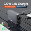 A multi-port GaN charger is shown connected to a laptop and a phone, with multiple cables plugged into the charger. Náhľad obrázku produktu