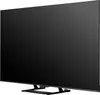 A side view of a black television on a stand. Voir les images du produit