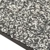 A close-up view of a grey and white gravel mat. Náhled obrázku produktu
