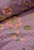 A close-up view of a floral patterned fabric with purple stripes. Produktbild-Vorschau