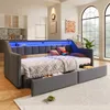 A modern living room with a sofa bed that has integrated LED lighting and storage drawers. Náhled obrázku produktu