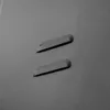 A close-up view of two indentations on a gray surface, possibly part of a metal cabinet. Anteprima dell’immagine prodotto