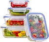 A stack of glass food storage containers filled with various fresh vegetables and a salad. Anteprima dell’immagine prodotto