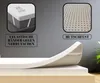 A collage showing details of a mattress topper, including its texture, corner straps, and a close-up of its anti-slip backing. The main part of the image shows the topper being placed on a mattress. Voir les images du produit