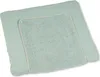 A light green changing mat cover with a waffle texture is shown from a diagonal top-down angle. Produktbild-Vorschau