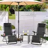 An outdoor patio scene with chairs, a table, and an umbrella. Produktbild-Vorschau