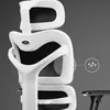Close-up of the headrest and back of a white ergonomic office chair. Voir les images du produit