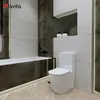 A modern bathroom with a bathtub and a toilet. Produktbild-Vorschau