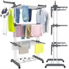 A multi-level drying rack with various clothing items and shoes on it, shown from a slightly elevated front-side angle. Náhľad obrázku produktu