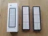 A white box and two filters are laid out on a wooden surface. Náhľad obrázku produktu