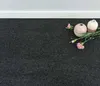 Two decorative vases and pink flowers are placed on a dark gray carpet next to a white baseboard. Produktbild-Vorschau