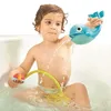 A young child is playing in a bathtub with bath toys. Anteprima dell’immagine prodotto