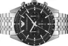 A close-up, front-facing view of an Emporio Armani chronograph watch with a black dial and silver metal band, set against a white background. Produktbild-Vorschau