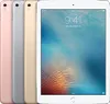 Four iPads are lined up, with the front one displaying a lock screen.