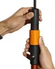 Hands adjusting a black and orange adapter on a pole. Náhled obrázku produktu