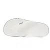 A top-down view of a white Crocs flip-flop on a white background. Produktbild-Vorschau