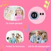 A collage of four images showing a young girl, a karaoke machine with microphones, a family singing, and an elderly couple singing, all on a pink background with musical notes. Produktbild-Vorschau