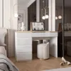 A modern bedroom with a white high-gloss vanity desk and stool. Produktbild-Vorschau