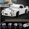 A white Lego-style model of a Mazda FC3S RX-7 car, with a partial image of a person in the background and a separate section showing power system components. Produktbild-Vorschau