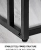 Close-up of the black metal frame of a table, showing its stable structure and adjustable feet, with a wooden floor in the background. Produktbild-Vorschau