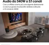 A living room with a TV, soundbar, and subwoofer, with animated sound waves emanating from the speakers. Voir les images du produit