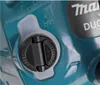 A close-up view of a cap on a teal-colored tool, with some text and symbols visible. Náhled obrázku produktu