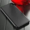 A black flip phone case is shown on a reflective surface with a red object in the background. Produktbild-Vorschau