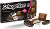 A box of Schogetten Black & White chocolates with some chocolates and cookies scattered around. Podgląd zdjęcia produktu