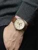 A person wearing a watch on their wrist. Produktbild-Vorschau