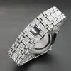 A close-up, angled view of a diamond-encrusted watch on a dark background. Produktbild-Vorschau