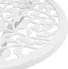 A close-up view of a white metal table with a decorative leaf pattern. Produktbild-Vorschau