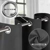 Close-up of dark gray curtains hanging on a rod, with a magnified view of the grommet and fabric texture. Produktbild-Vorschau
