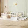 A white bunk bed with a pull-out trundle bed in a child's bedroom. Produktbild-Vorschau
