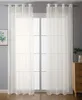A room interior with a window covered by sheer white curtains. Produktbild-Vorschau