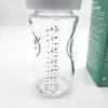 Close-up of a glass baby bottle with measurement markings. Podgląd zdjęcia produktu