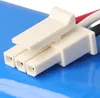 A close-up view of a white electrical connector with three pins, attached to a blue surface. Produktbild-Vorschau