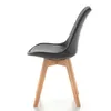 A side view of a modern dining chair with a gray velvet seat and wooden legs, isolated on a white background. Podgląd zdjęcia produktu