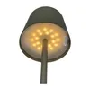A close-up, low-angle view of a modern table lamp with an LED light source visible. Produktbild-Vorschau