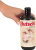 A hand holding a bottle of "flutschi ORGY-OIL" with an image of people on the label. Produktbild-Vorschau