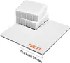 Several white interlocking tiles are laid out on a white surface, with two stacks of tiles in the background. A measurement indicator shows '1 SQ. FT' and '12.4 inch / 315 mm'. Podgląd zdjęcia produktu