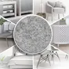 A collage of different interior design elements with a central focus on a grey felt material. Produktbild-Vorschau