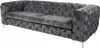 A gray tufted sofa viewed from a side angle. Náhled obrázku produktu