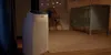 A Philips air purifier is shown in a nursery setting next to a crib. Produktbild-Vorschau