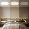 A bedroom scene showing a ceiling light with adjustable brightness and color temperature. Produktbild-Vorschau