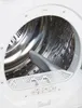 Close-up view of the inside of a white washing machine drum. Produktbild-Vorschau